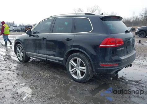 2014 Volkswagen Touareg 3.6L R-Line z USA, uszkodzony, nr VIN WVGDF9BP2ED002584